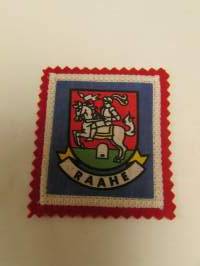 Raahe-kangasmerkki / matkailumerkki / hihamerkki / badge -pohjaväri punainen
