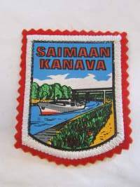 Saimaan kanava -kangasmerkki / matkailumerkki / hihamerkki / badge -pohjaväri punainen