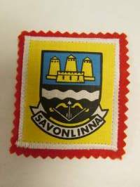 Savonlinna -kangasmerkki / matkailumerkki / hihamerkki / badge -pohjaväri punainen