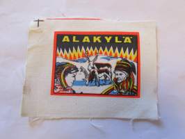 Alakylä -kangasmerkki, matkailumerkki, leikkaamaton