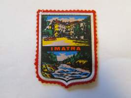 Imatra -kangasmerkki / matkailumerkki / hihamerkki / badge -pohjaväri punainen