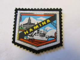 Hamina -kangasmerkki / matkailumerkki / hihamerkki / badge -pohjaväri musta
