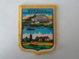 Kokkola - Gamlakarleby -kangasmerkki / matkailumerkki / hihamerkki / badge -pohjaväri keltainen