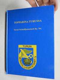 Topparina Turussa - Turun Verhoilijamestarit Ry. 70 vuotta -historiikki