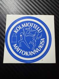 Kolmiottelu Maitokannukisa tarra