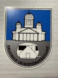 Helsingin leirintämatkailijat -tarra