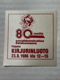 Kirjurinluoto 80 vuotta -tarra