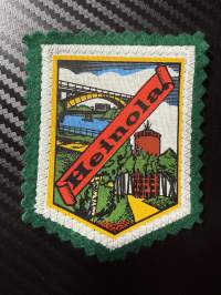 Heinola -kangasmerkki / matkailumerkki / hihamerkki / badge -pohjaväri vihreä