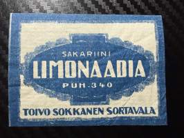 Sakariini Limonaadia -etiketti